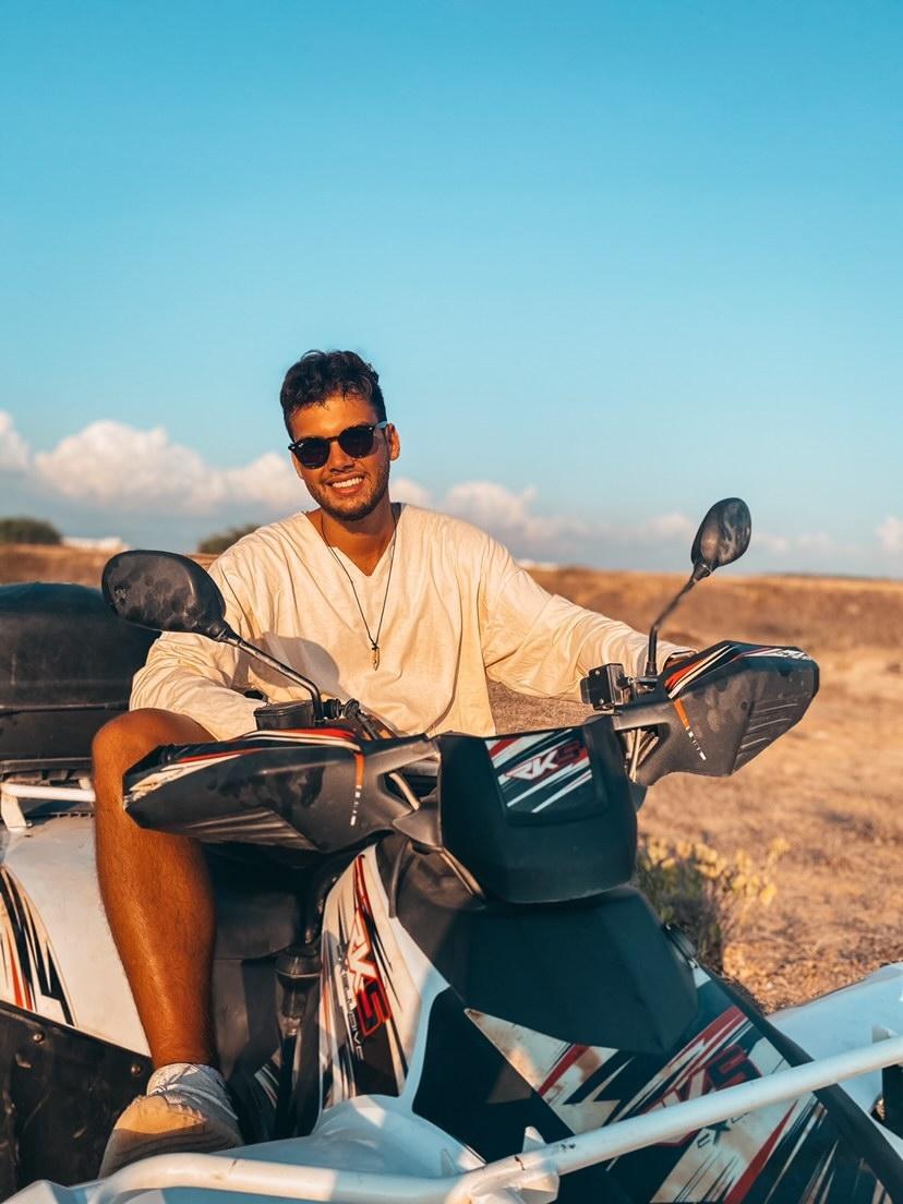 guy riding a scooter