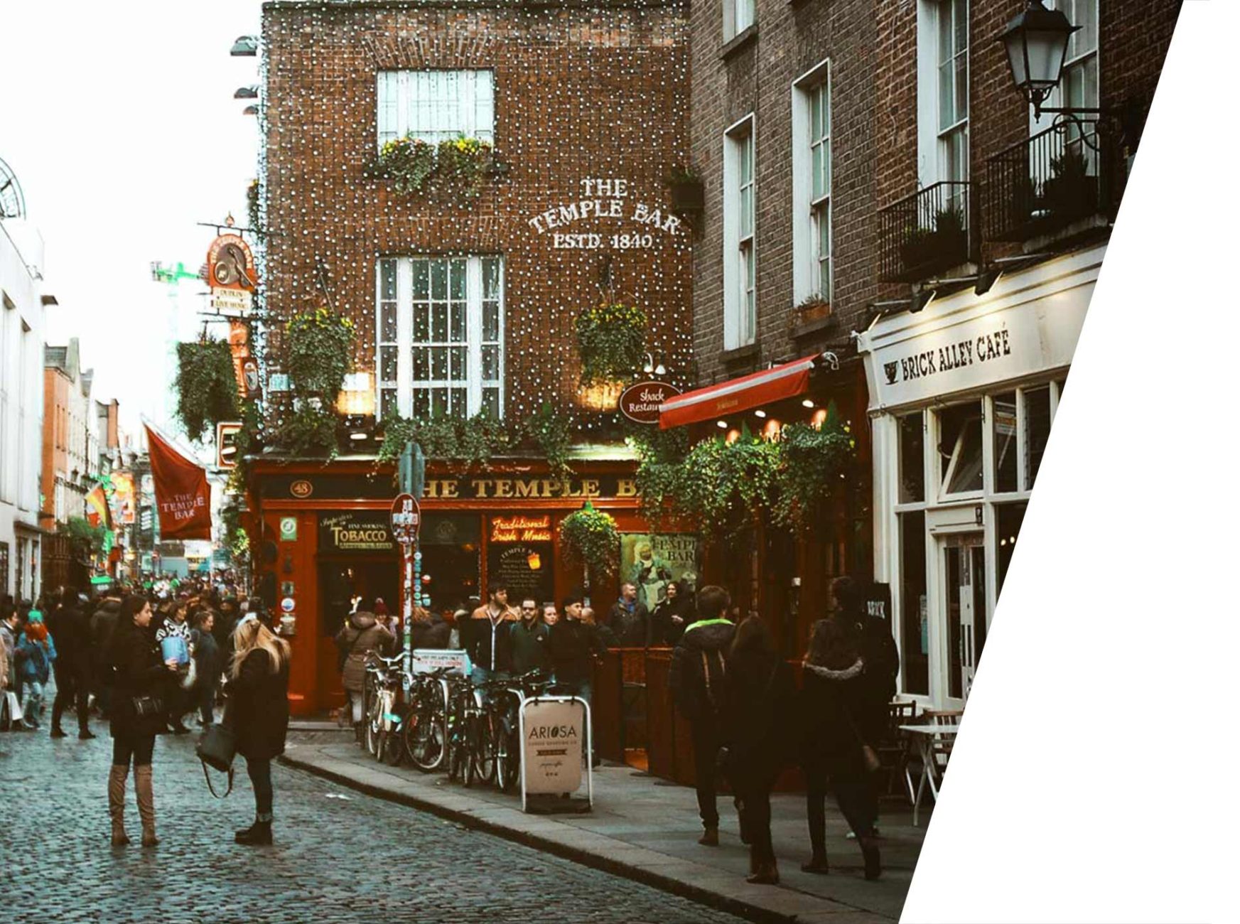 Cozy street in Dublin with pubs and shops.