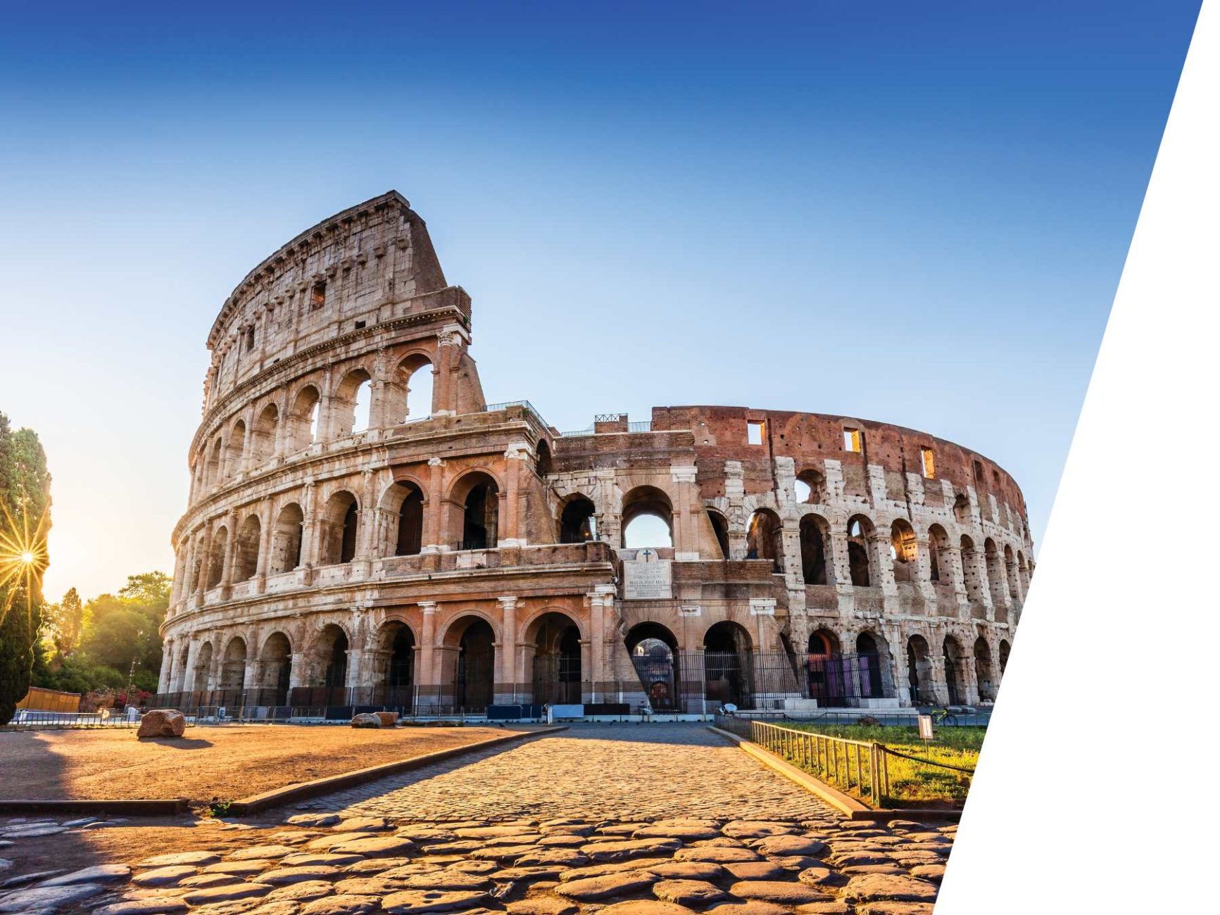 Colosseum with a blue sky in the background.