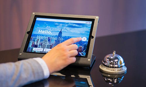 Hotel Reception with a Bell and tablet on the table