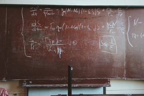an old backboard with mathematic symbols and numbers