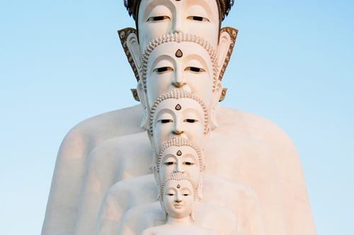 a white statue with 5 heads in Phuket
