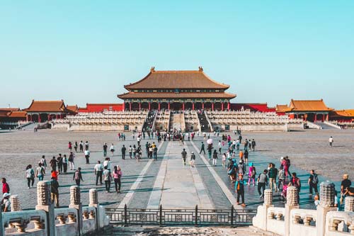 people outside of a temple in china