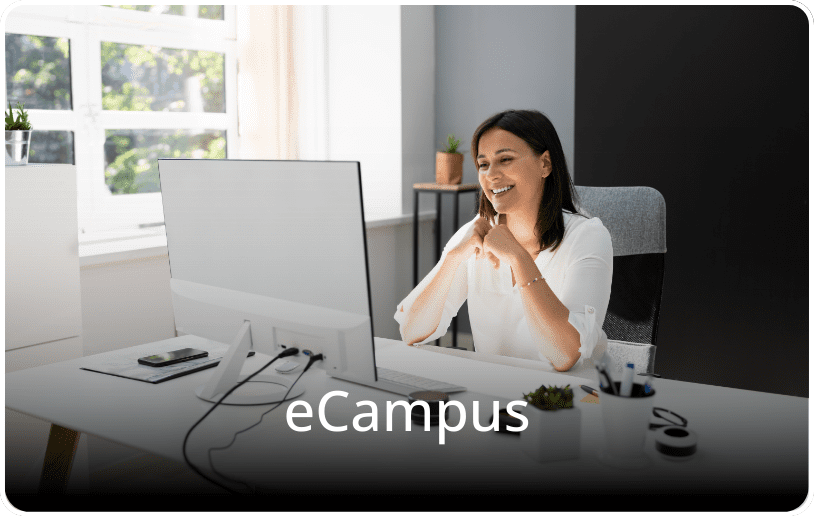 Girl sitting in front of a computer and smiling, with the text “eCampus” overlaid on the image.