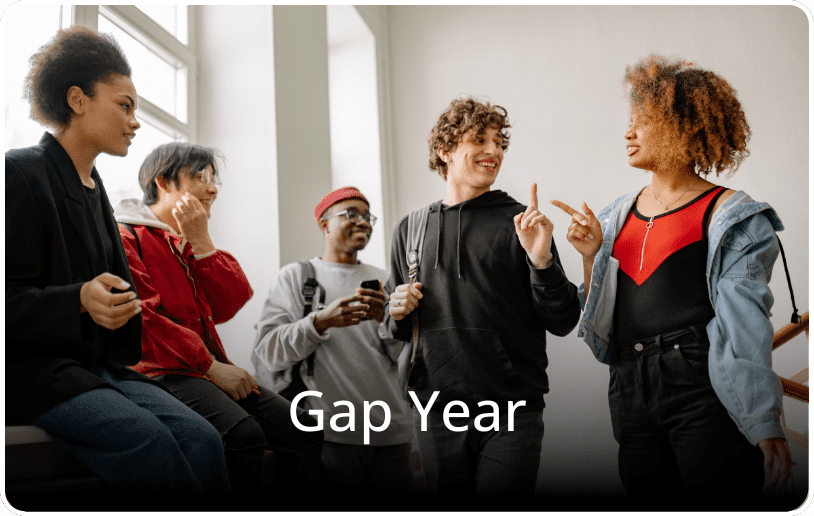 Students talking and smiling together in a casual setting, with the text “Gap Year” overlaid on the image.